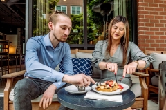 P1211825_WCV_Couple-Eating-Waffles_Outside-Restaurant