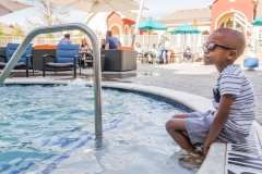 P1099484_Kid-Sitting_Edge-of-Pool